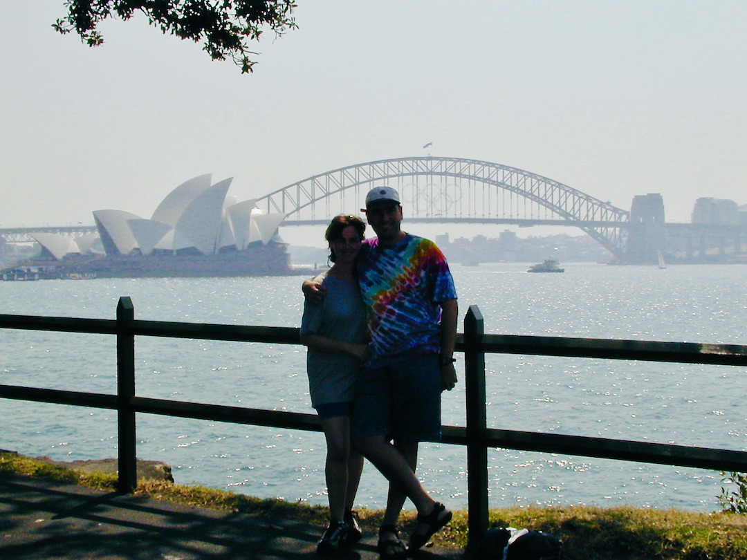 Schindlers on Tour in Sydney Sharon and David Schindler with the Sydney Opera House and Sydney Bridge behind them.