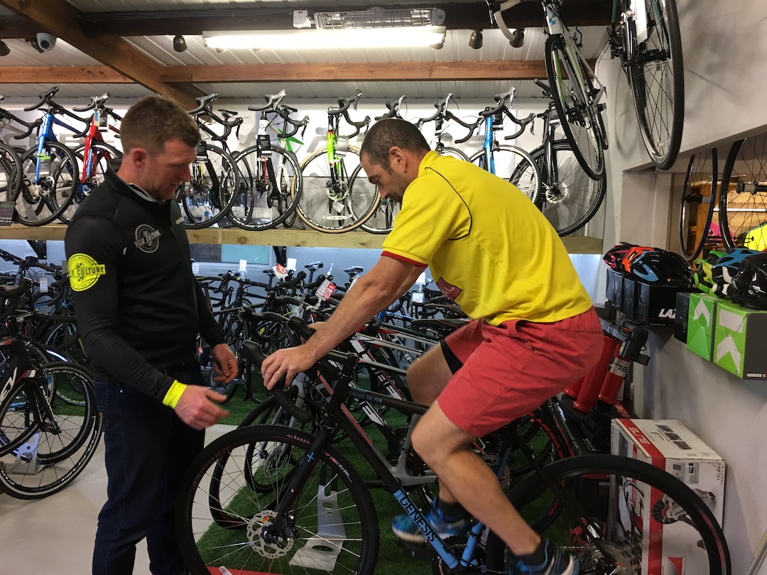 Choosing a touring bike Dave testing a bicycle in Velo Culture with Stevie the owner