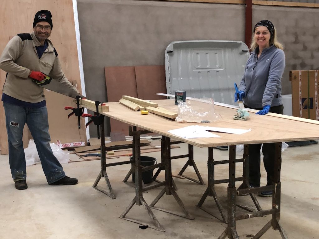 Dave and Sharon Schindler at a workbench