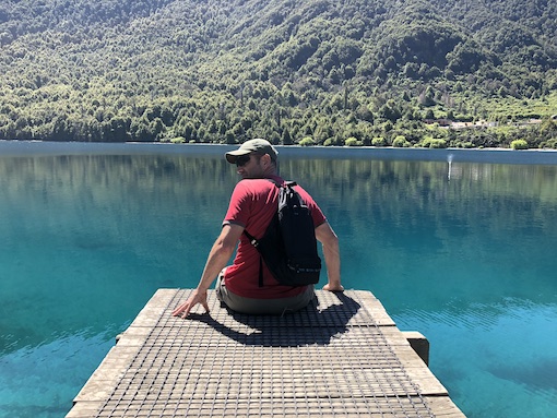 Dave sitting on the jetty at Bob's Cove, Queenstown, New Zealand