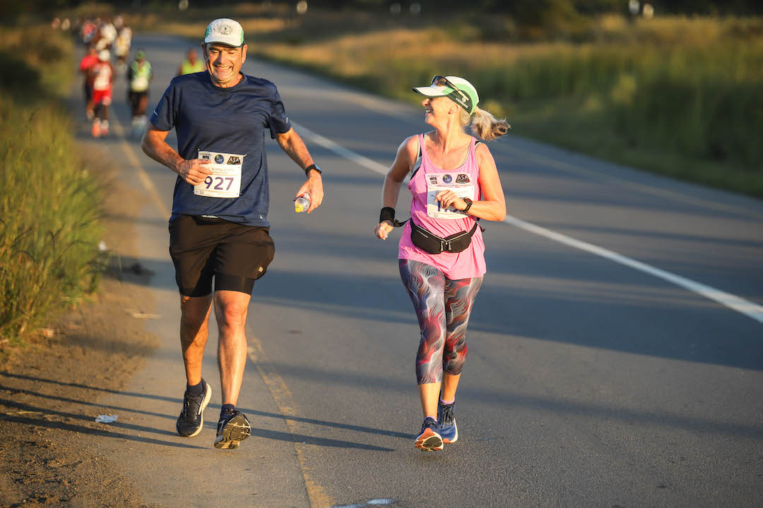 Running Buffalo City Marathon Dave and Sharon Schindler running on the road